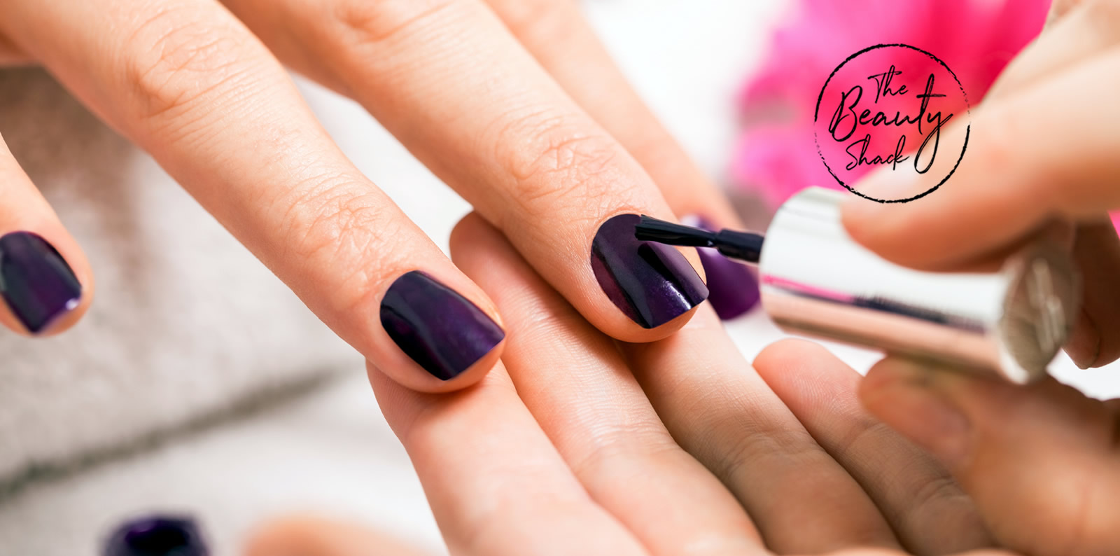 Woman having nails painted - The Beauty Shack Salon Logo