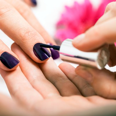 Woman having manicure